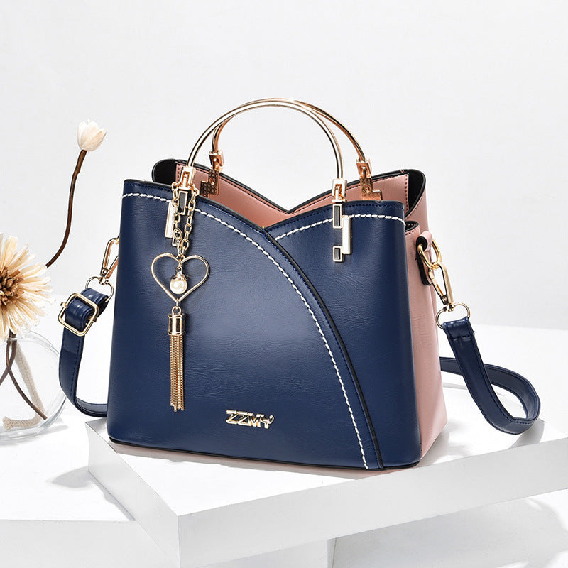 Jade – Farbblock-Handtasche mit Quasten-Dekor für Damen