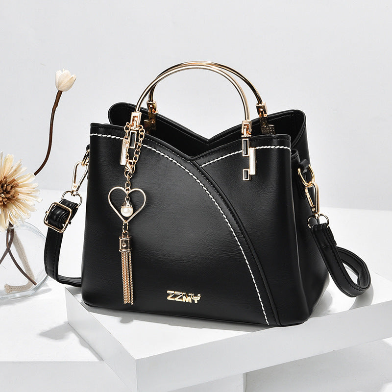 Jade – Farbblock-Handtasche mit Quasten-Dekor für Damen