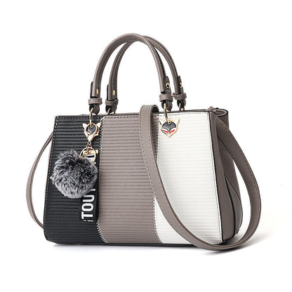 Patricia – Damen-Handtasche mit Haarballen-Ornamenten