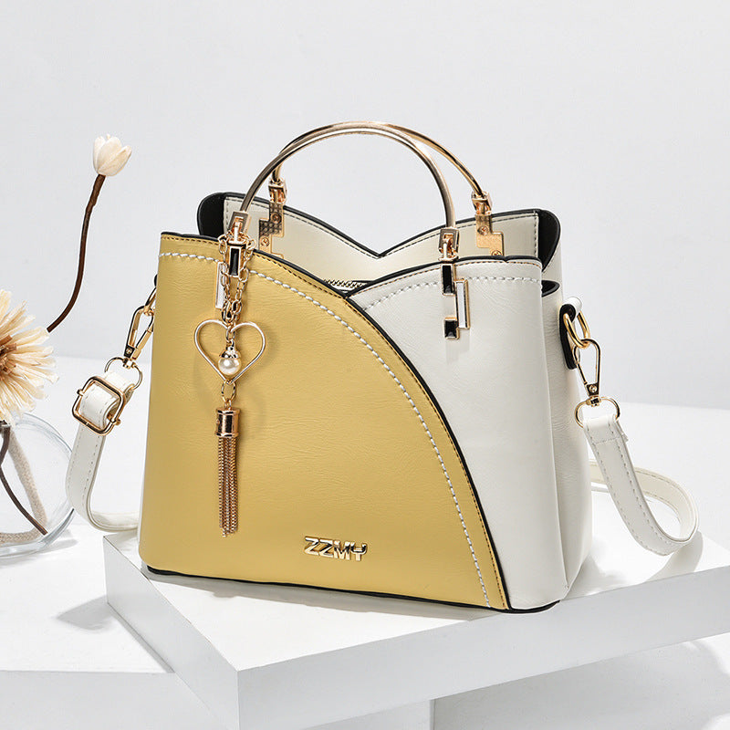 Jade – Farbblock-Handtasche mit Quasten-Dekor für Damen